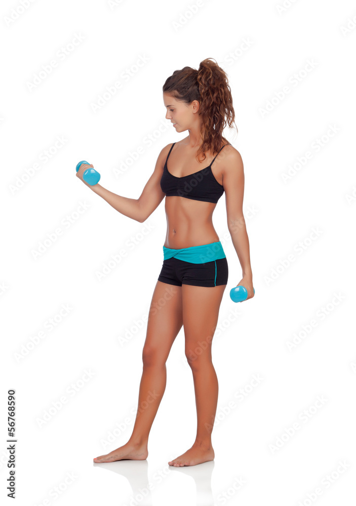 Beautiful woman doing weights to tone her muscles Beautiful woman doing weights to tone her muscles