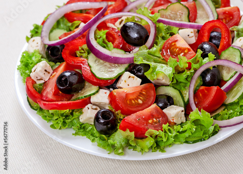 The Greek and Italian food - fresh vegetable salad on the table