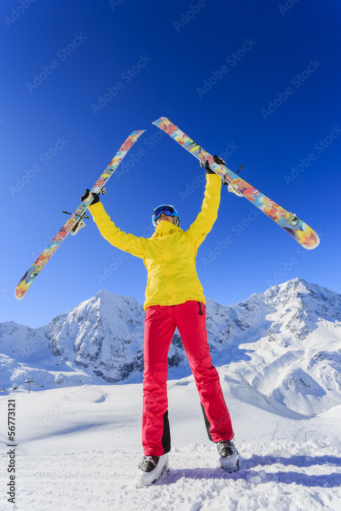 Ski and winter fun - woman enjoying ski vacation