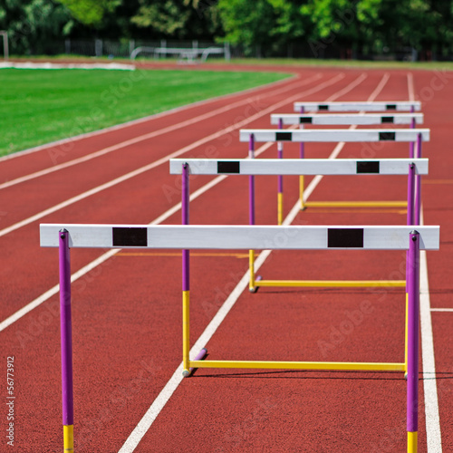 The concept of sport - the barriers on the treadmill stadium.