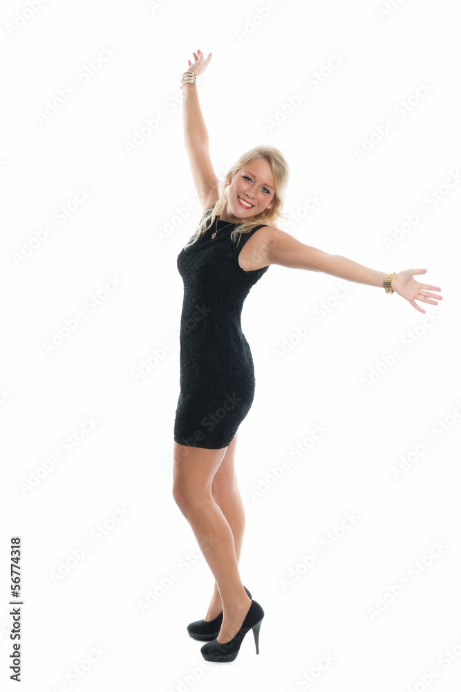 Tanzende blonde Frau im Minikleid