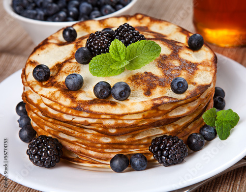 Delicious pancakes with blackberries and mint leaves