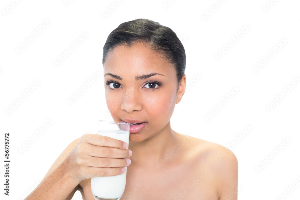 Charming young dark haired model drinking milk Charming young dark haired model drinking milk