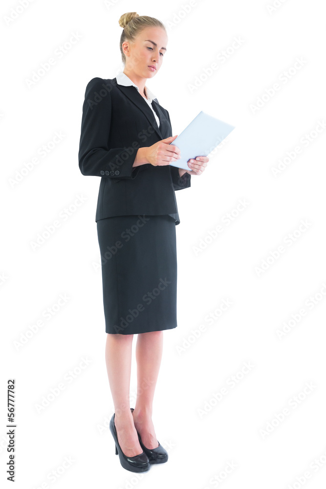 Low angle side view of attractive blonde businesswoman making us Low angle side view of attractive blonde businesswoman making us