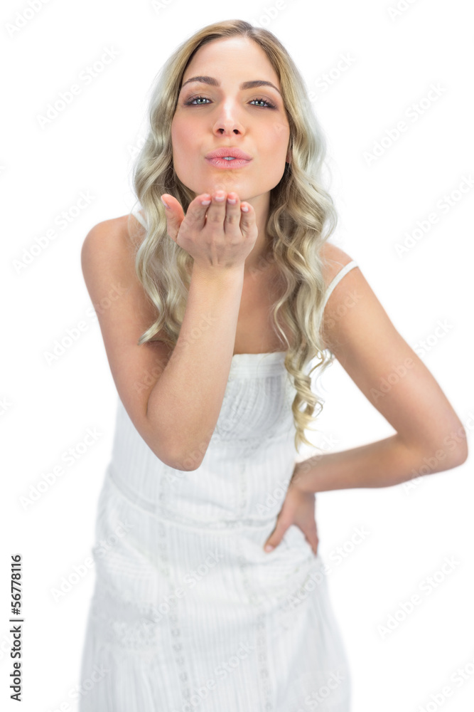 Cheerful blonde sending a kiss to camera Cheerful blonde sending a kiss to camera