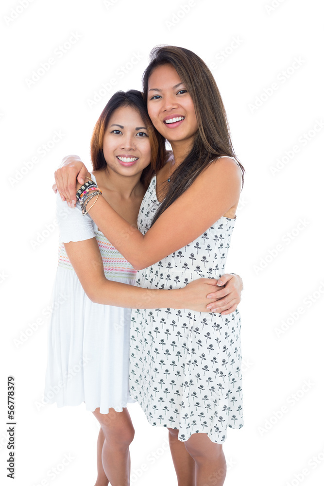 Two sweet sisters hugging each other