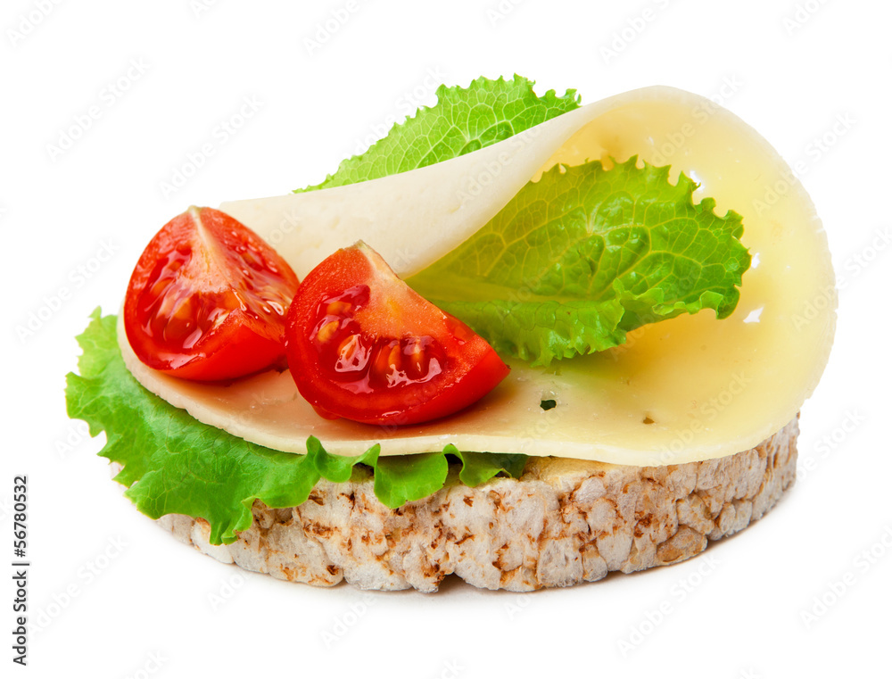 Concept diet - cheese lettuce and tomato on a rice wafer