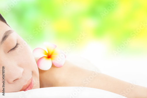 relaxed young woman in spa salon