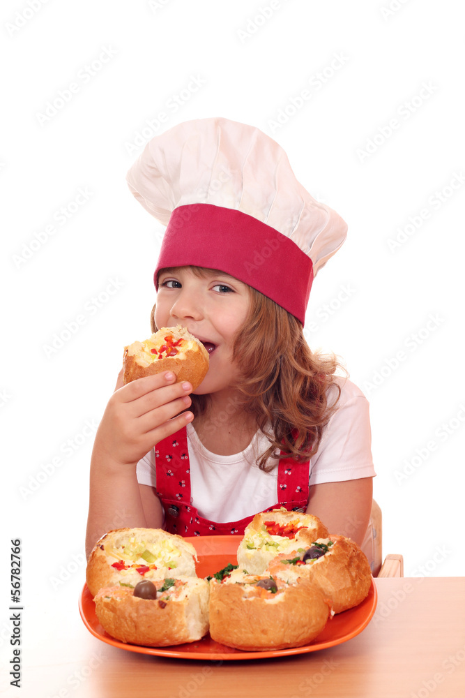 little girl cook eat bread filled with cheese and vegetables little girl cook eat bread filled with cheese and vegetables