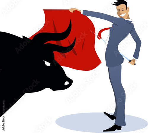 Businessman torero fighting a bull