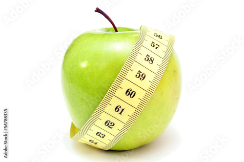 green apple with measure tape