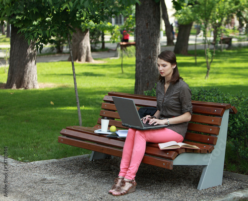 Young Woman Studying in a Park