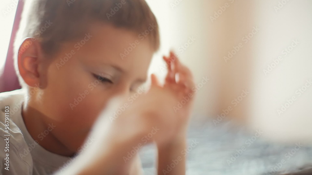 little boy playing on the tablet computer games