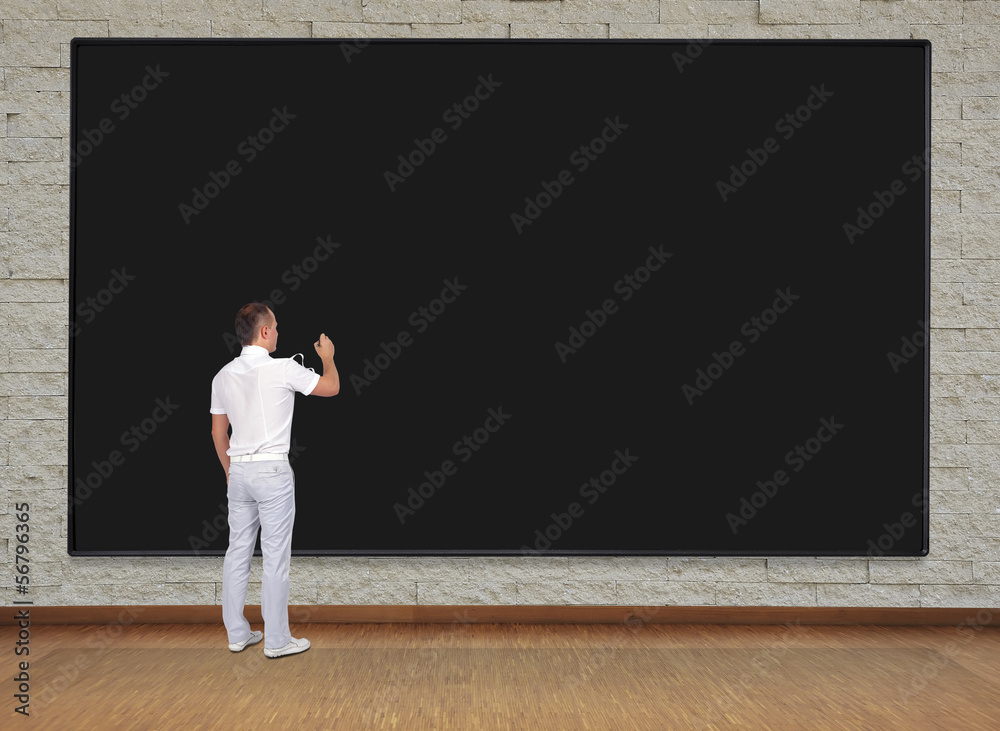 man drawing on blackboard