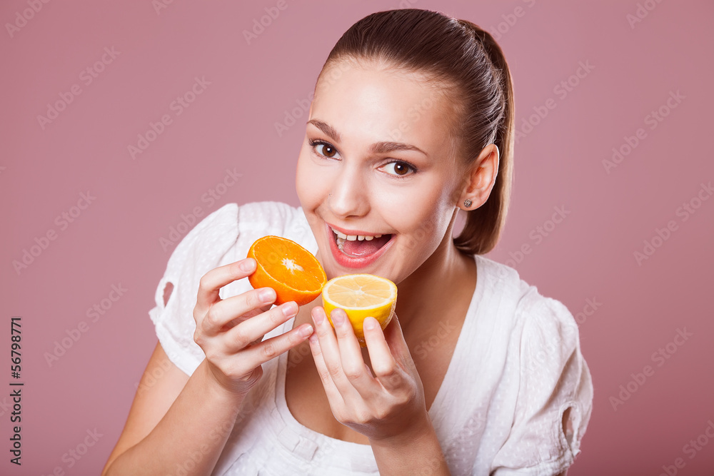 Portrait of a young beautiful woman with orange Portrait of a young beautiful woman with orange