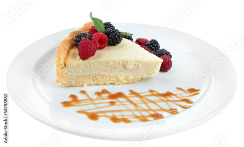 Slice of cheesecake with berries and sauce