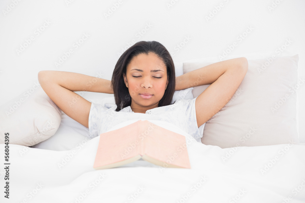 Relaxed young dark haired model sleeping in her bed Relaxed young dark haired model sleeping in her bed