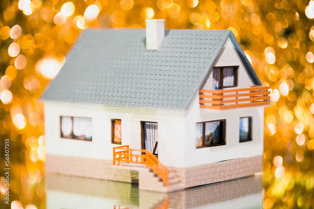 festive house against golden bokeh background