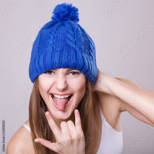 Cute girl in blue knit cap.