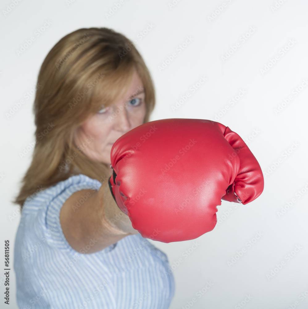 Woman wearing a red boxing glove Woman wearing a red boxing glove