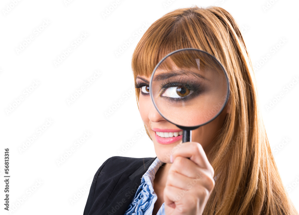 Businesswoman looking through magnifying glass Businesswoman looking through magnifying glass