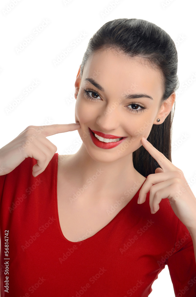 Happy girl smiling pointing to her beautiful smile. Happy girl smiling pointing to her beautiful smile.