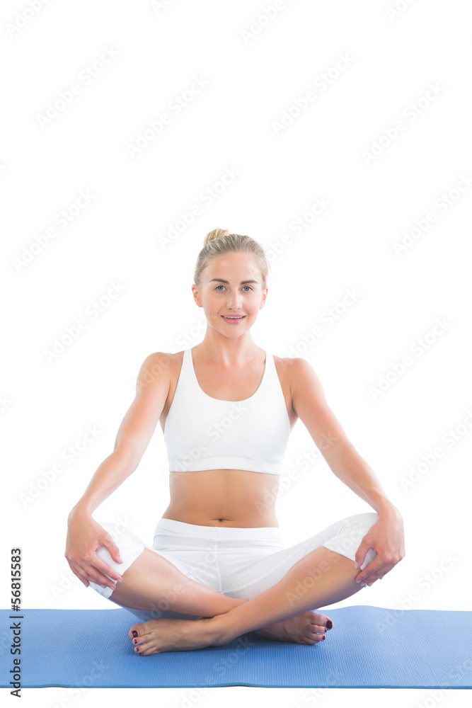 Toned content blonde sitting in lotus pose Toned content blonde sitting in lotus pose