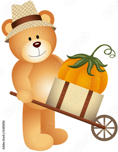 Teddy bear carrying pumpkin in wooden cart