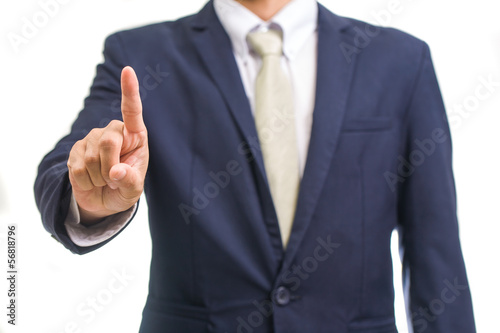 portrait of young business man pointing up