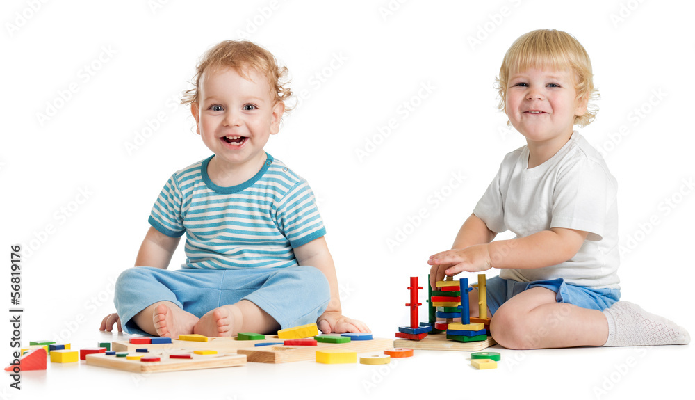 Two happy kids playing logical educational toys Two happy kids playing logical educational toys