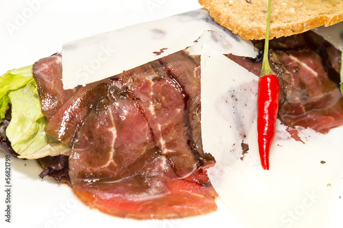 Beef carpaccio on a table in a restaurant photo