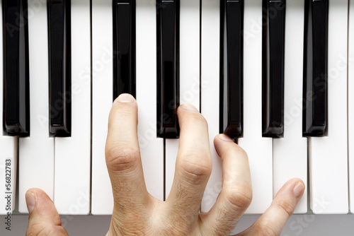 Hand playing piano