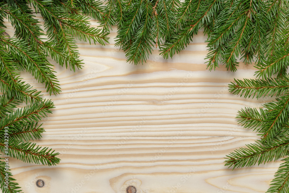 christmas background from fir twigs on wooden table christmas background from fir twigs on wooden table