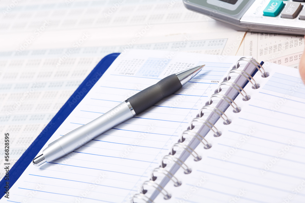 Pen and a notebook. Pen and a notebook.