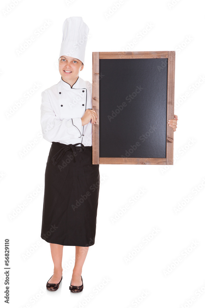 Female chef holding blank menu board Female chef holding blank menu board
