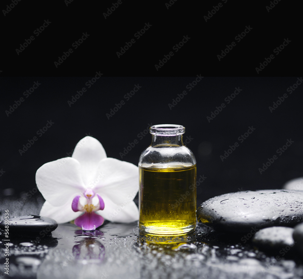 Spa still with massage oil, orchid pebbles Spa still with massage oil, orchid pebbles