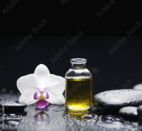 Spa still with massage oil  orchid pebbles