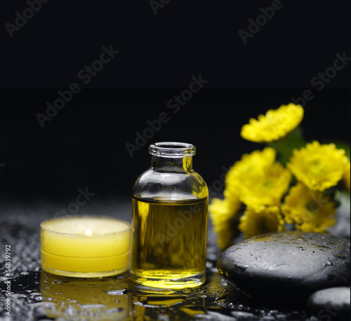 Spa feeling with candle ,stones , massage oil, wet pebbles