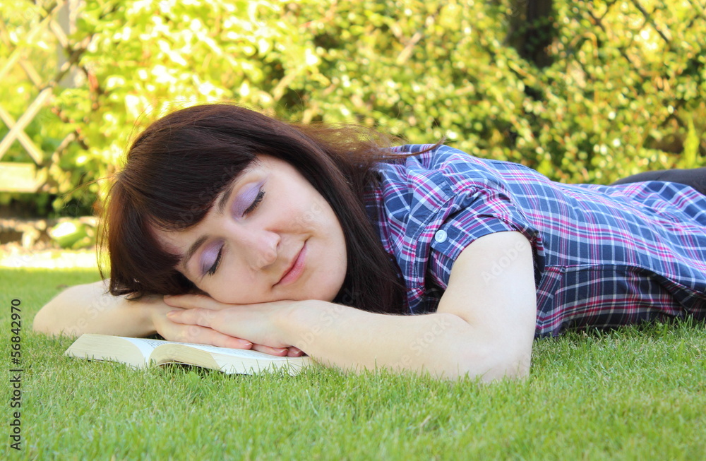 Sleeping woman after reading a book Sleeping woman after reading a book