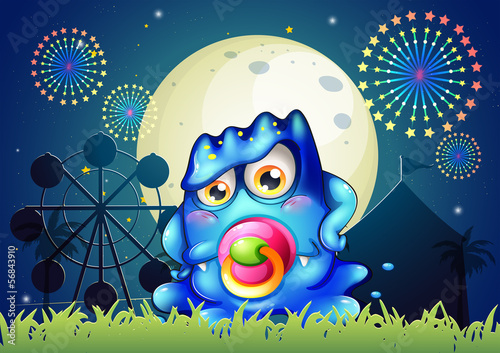 A carnival with a baby blue monster with a pacifier