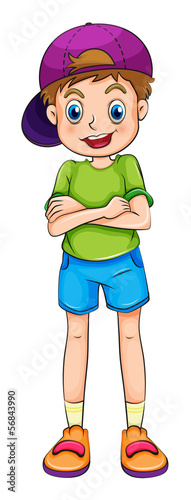 A smiling young boy with a cap