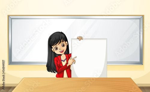 A girl near the table holding an empty signage