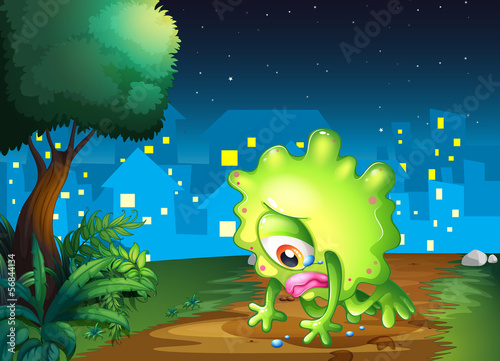 A tired monster facing the ground near the tree