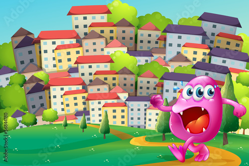 A monster walking at the hill across the buildings