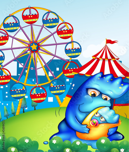 A carnival with a mother monster carrying her baby