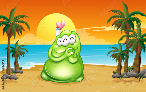 A beach with a green monster