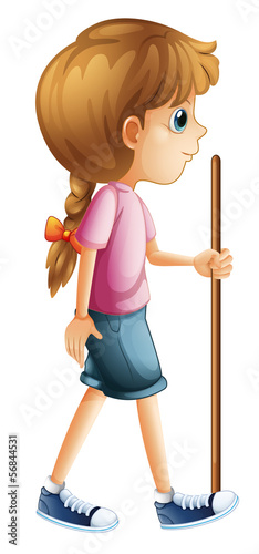 A young lady hiking with a stick