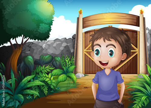 A young gentleman inside the gated yard