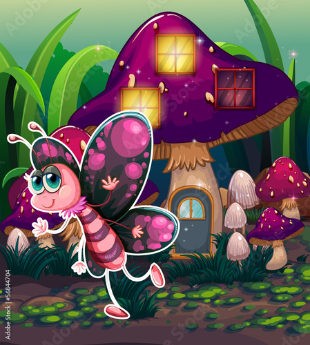 A colorful butterfly near the lighted mushroom house
