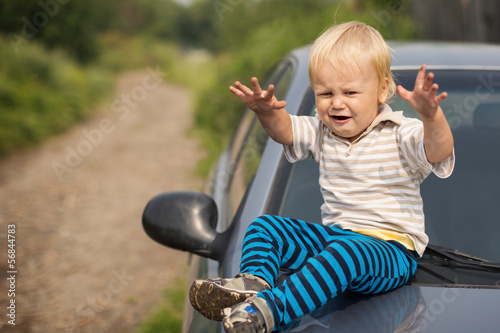 Boy Cries By the Car